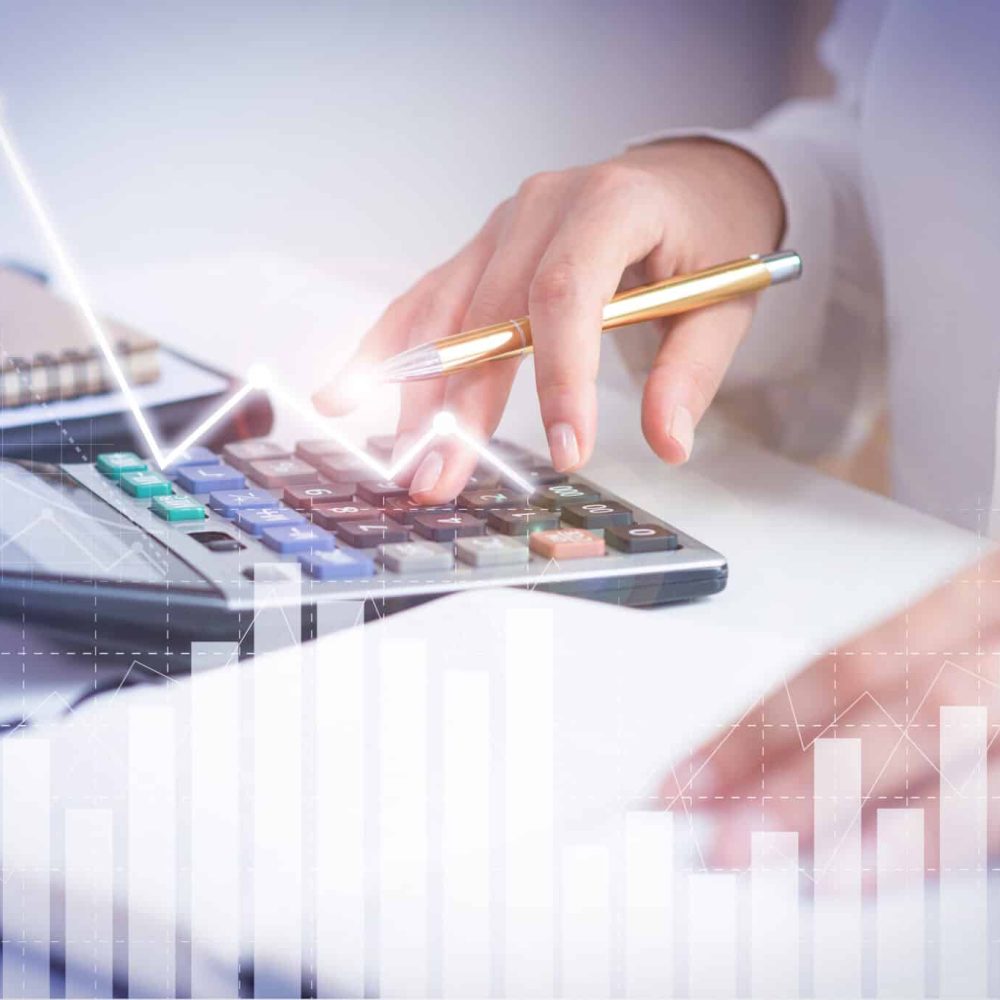 Accountant calculating profit with financial analysis graphs